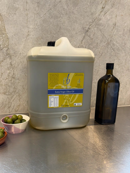 20L Olive Blue extra virgin olive oil container on kitchen counter with olives and bottle